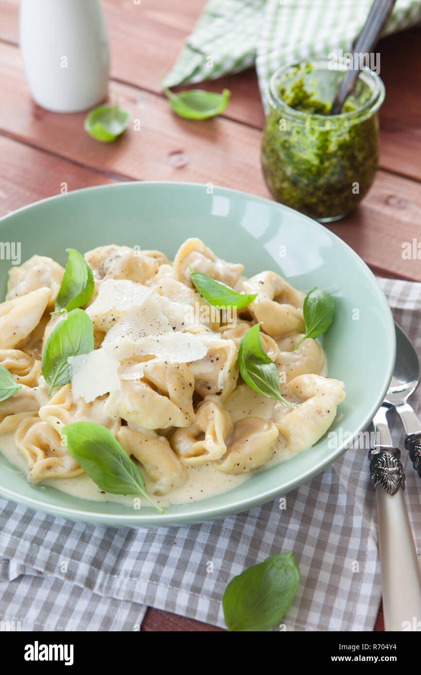 tortellini in cheese cream sauce Stock Photo Alamy