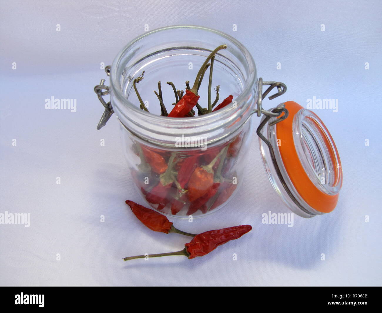 red chili peppers in glass Stock Photo - Alamy