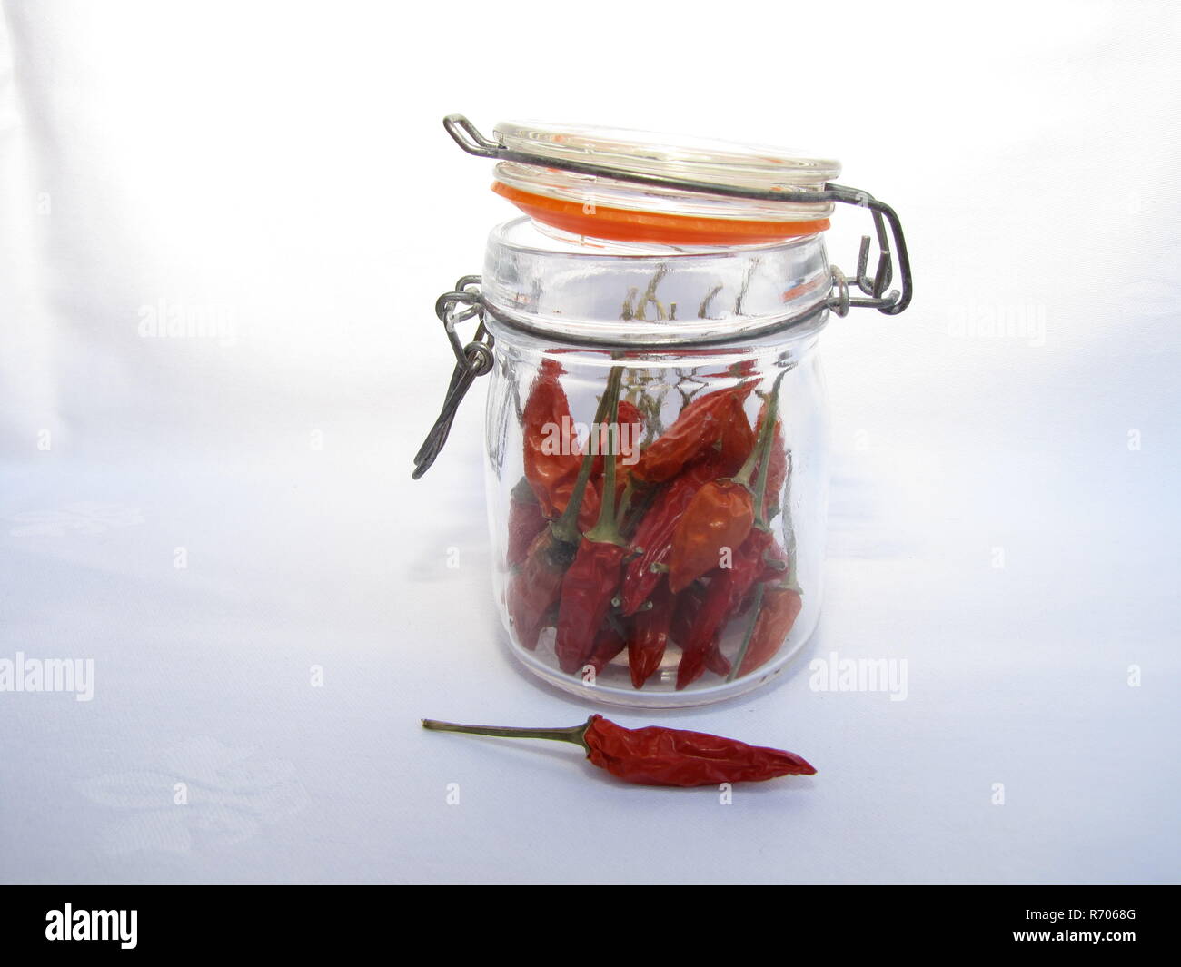 red chili peppers in the glass Stock Photo - Alamy