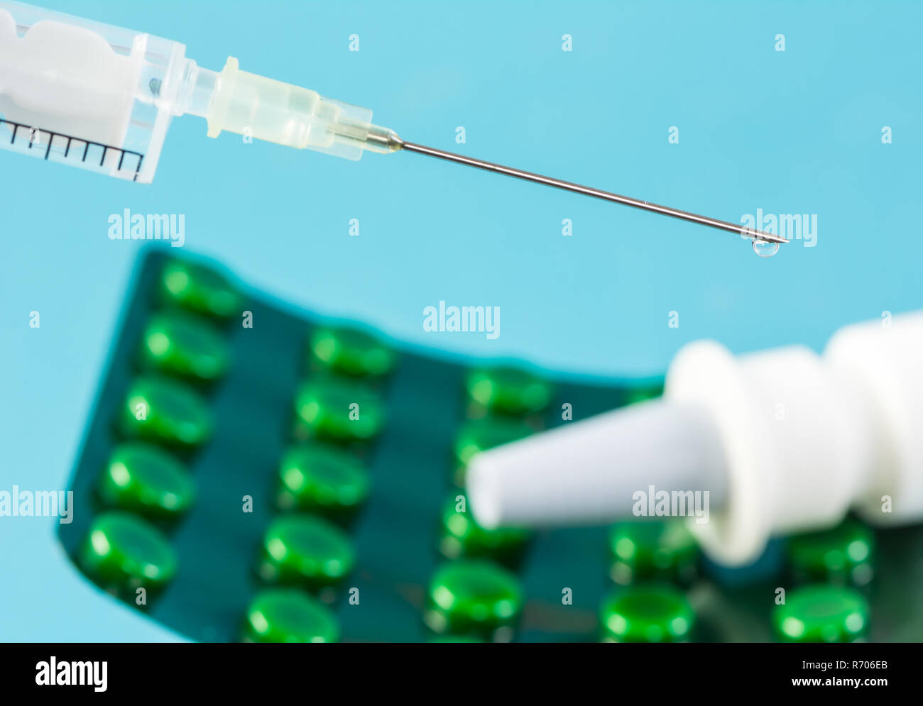 Syringe and a blister pack with tablets Stock Photo Alamy