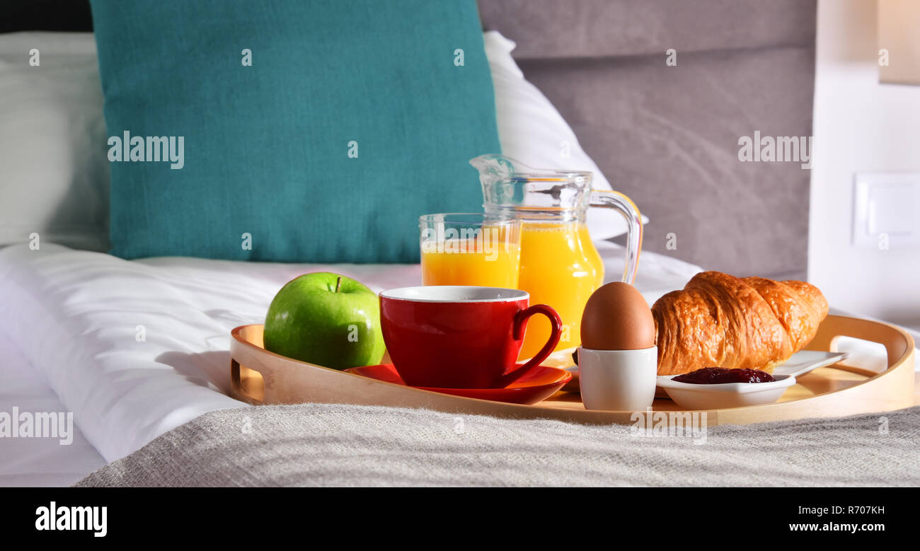 Breakfast on tray in bed in hotel room Stock Photo - Alamy