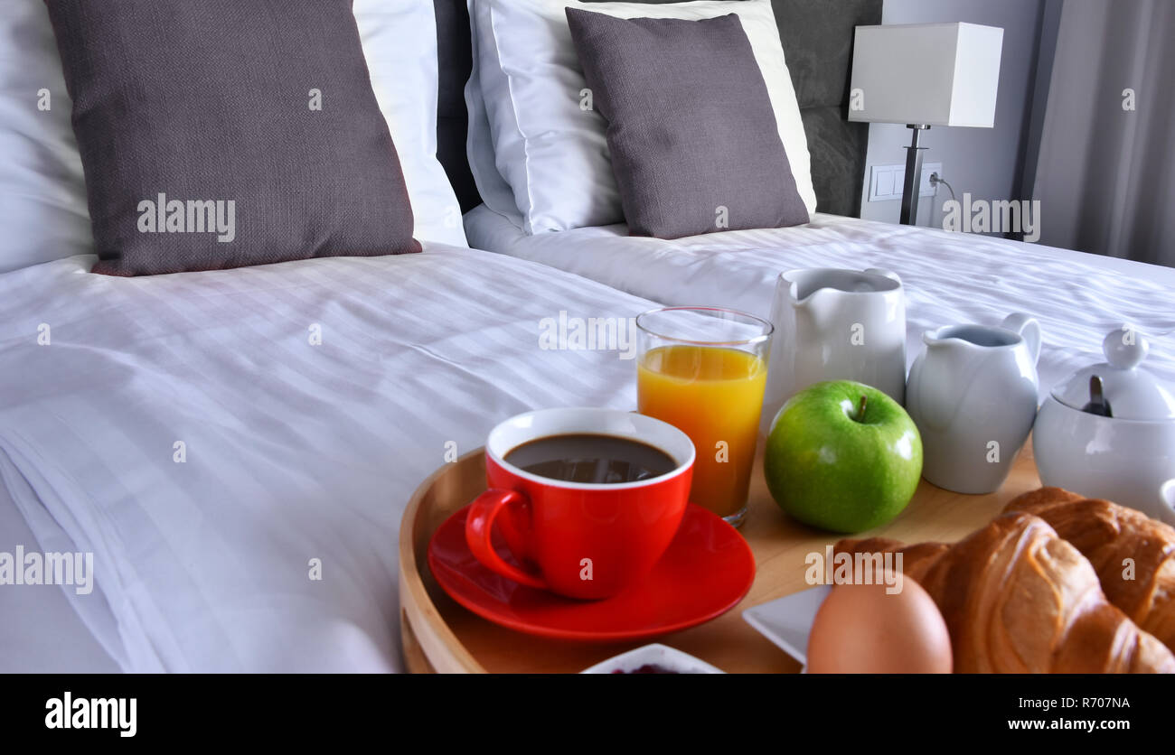 Breakfast on tray in bed in hotel room Stock Photo - Alamy