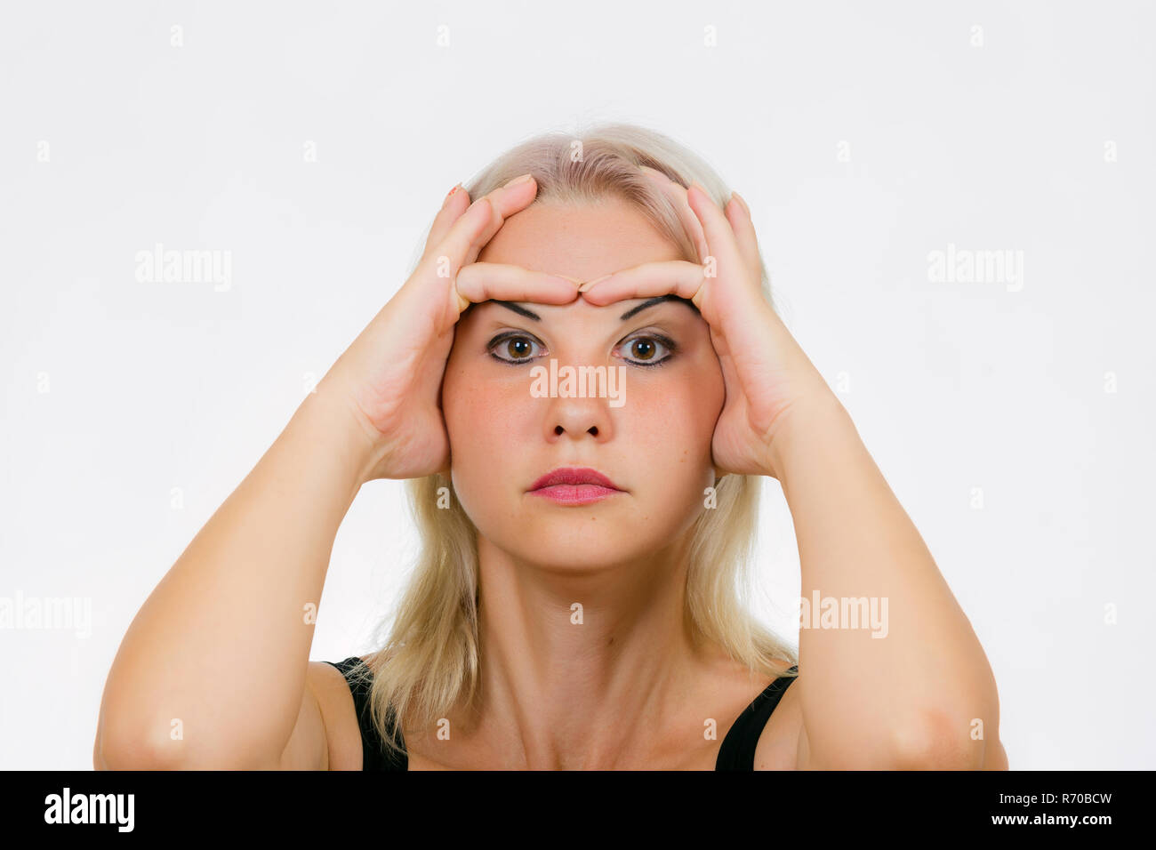 Face exercise for EYELIDS, woman lift her brows up and down with