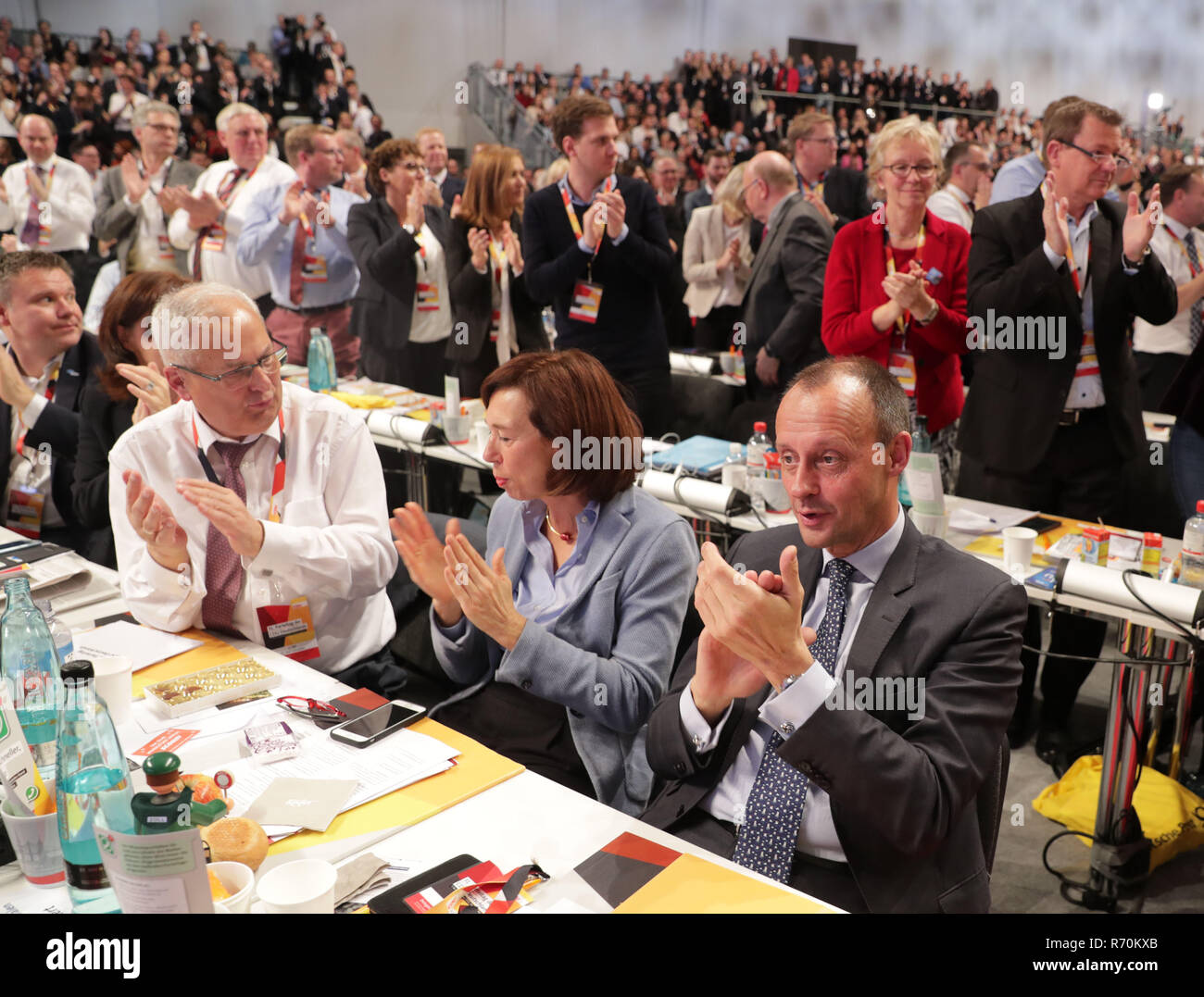 Hamburg, Germany. 07th Dec, 2018. The candidate for party chair, Friedrich Merz (CDU) and his wife Charlotte are sitting at the table of the North Rhine-Westphalia state association at the CDU federal party conference. The delegates elect a new party chairman in the afternoon. Left Karl Schneider (CDU) District Administrator of the Hochsauerland District. Credit: Kay Nietfeld/dpa/Alamy Live News Stock Photo