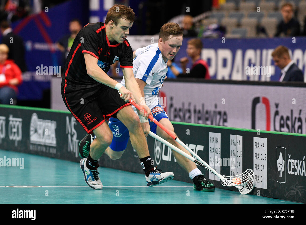 Prague, Czech Republic. 07th Dec, 2018. L-R Maximillian Falkenberger (GER) and Krister Savonen (FIN) in action during the Men's World Floorball Championships quarterfinal match Finland vs Germany, played in Prague, Czech Republic, on December 7, 2018. Credit: Michal Kamaryt/CTK Photo/Alamy Live News Stock Photo
