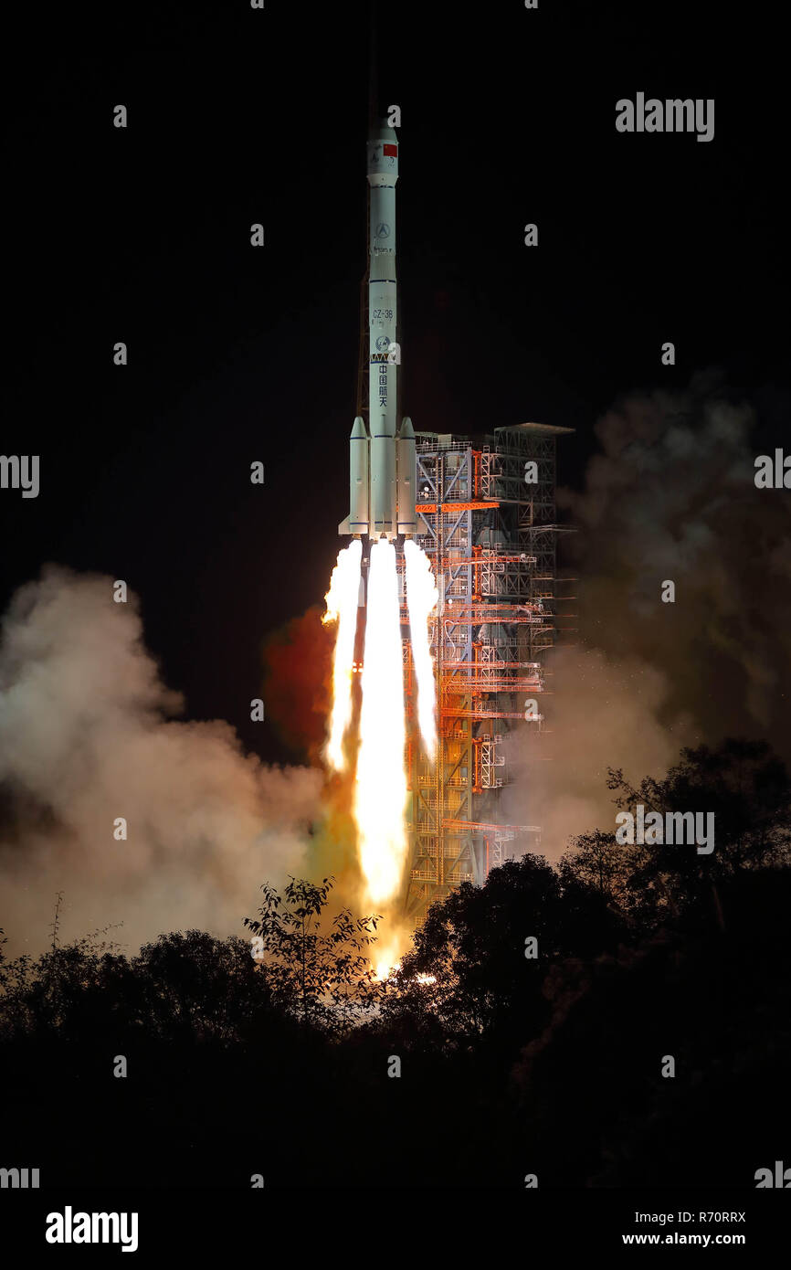 (181208) -- XICHANG, Dec. 8, 2018 (Xinhua) -- China launches Chang'e-4 lunar probe in the Xichang Satellite Launch Center in southwest China's Sichuan Province, Dec. 8, 2018. The probe is expected to make the first-ever soft landing on the far side of the moon. A Long March-3B rocket, carrying the probe including a lander and a rover, blasted off from Xichang at 2:23 a.m., opening a new chapter in lunar exploration. The scientific tasks of the Chang'e-4 mission include low-frequency radio astronomical observation, surveying the terrain and landforms, detecting the mineral composition and shall Stock Photo
