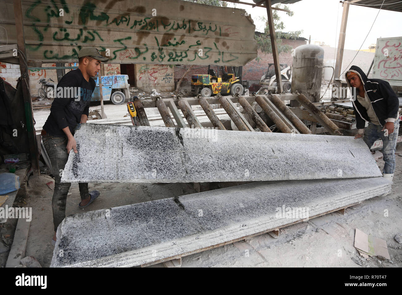 Cairo, Egypt. 6th Dec, 2018. People work in a marble and granite factory in Cairo, Egypt, on Dec. 6, 2018. In Shaq al-Thu'ban vast marble and granite industrial cluster near Egyptian capital Cairo's Maadi district, about 40 Chinese and Egyptian cooperative granite factories and 30 marble factories have significantly contributed to boosting the industry in the most populous Arab country. Credit: Ahmed Gomaa/Xinhua/Alamy Live News Stock Photo