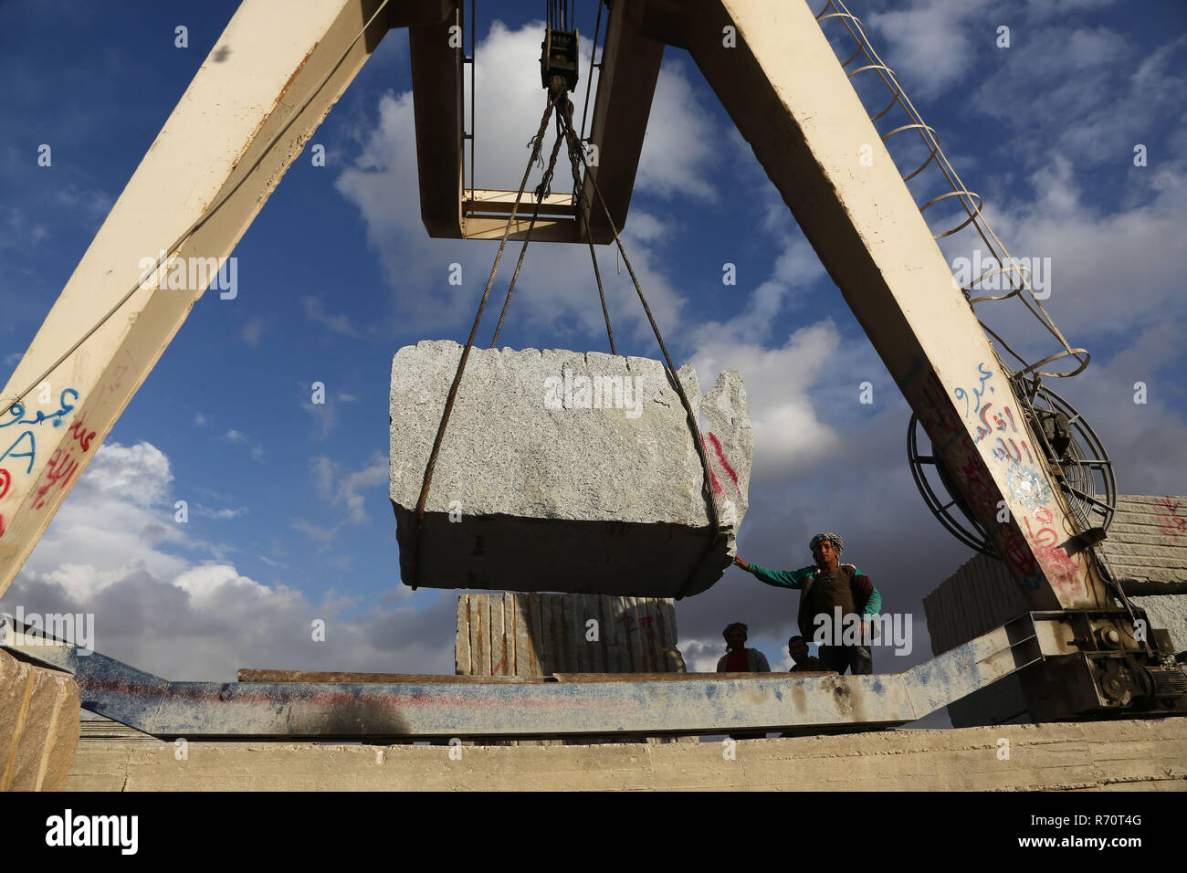 Cairo, Egypt. 6th Dec, 2018. People work in a marble and granite factory in Cairo, Egypt, on Dec. 6, 2018. In Shaq al-Thu'ban vast marble and granite industrial cluster near Egyptian capital Cairo's Maadi district, about 40 Chinese and Egyptian cooperative granite factories and 30 marble factories have significantly contributed to boosting the industry in the most populous Arab country. Credit: Ahmed Gomaa/Xinhua/Alamy Live News Stock Photo