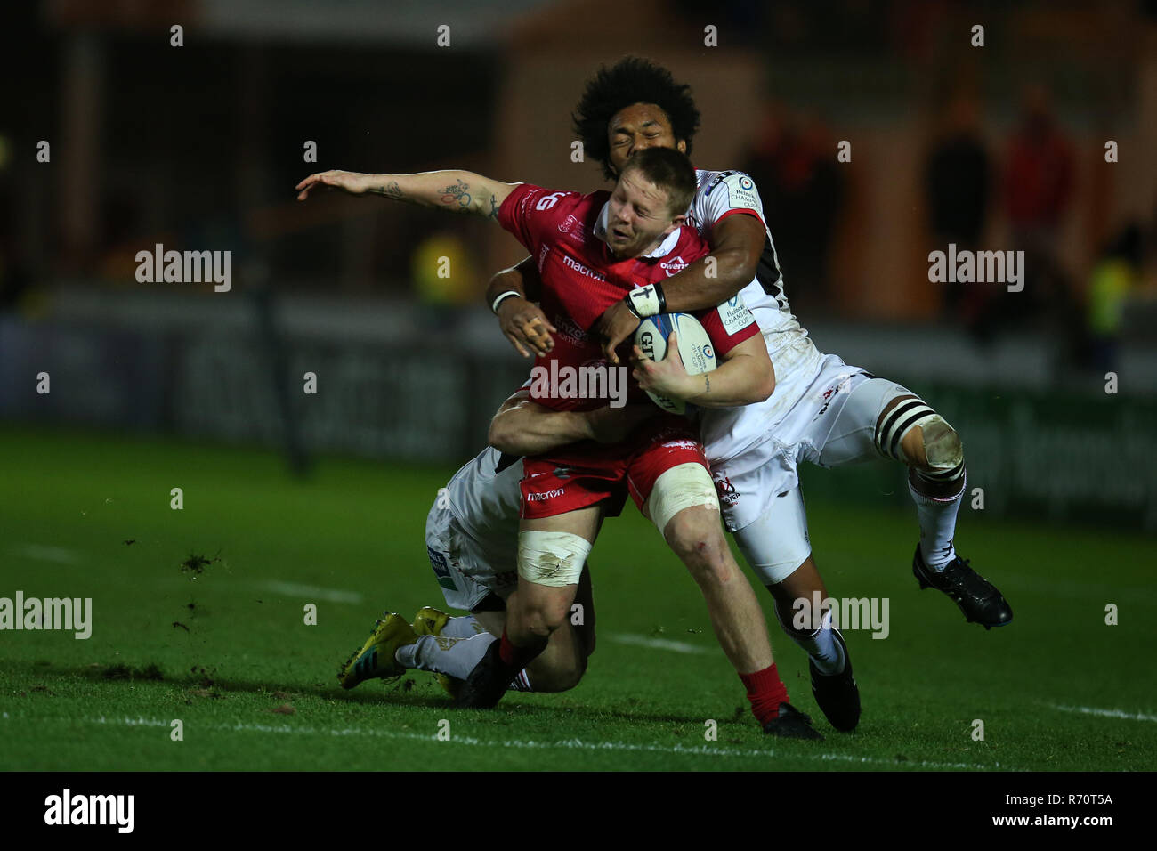James Davies of the Scarlets is  tackled by Ulster's  Henry Speight ® . Scarlets v Ulster rugby, Heineken European Champions Cup, pool 4 match at Parc y Scarlets in Llanelli, South Wales on Friday 7th December 2018.  picture by Andrew Orchard/Andrew Orchard sports photography/Alamy Live News Stock Photo