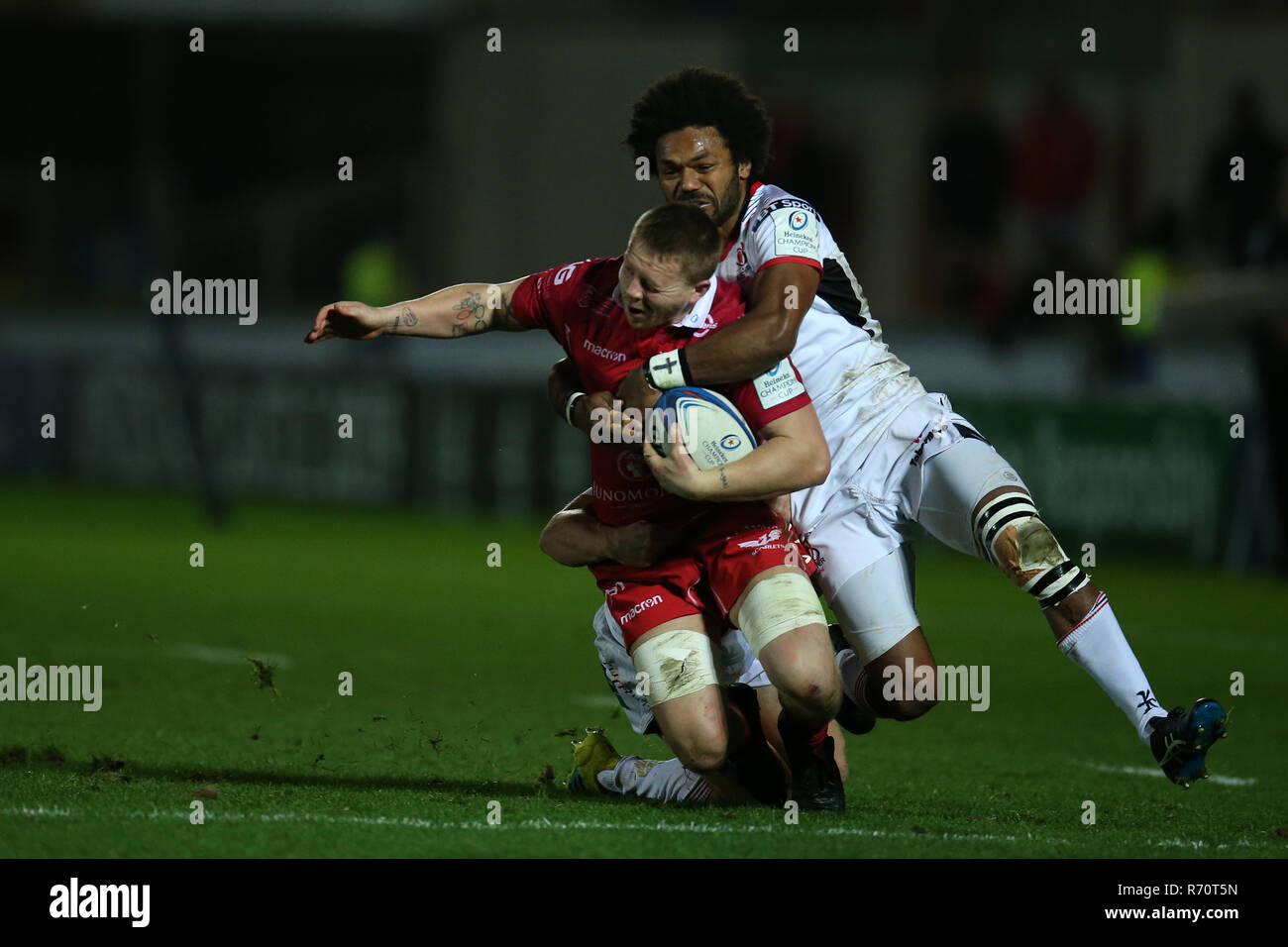 James Davies of the Scarlets is  tackled by Ulster's  Henry Speight ® . Scarlets v Ulster rugby, Heineken European Champions Cup, pool 4 match at Parc y Scarlets in Llanelli, South Wales on Friday 7th December 2018.  picture by Andrew Orchard/Andrew Orchard sports photography/Alamy Live News Stock Photo