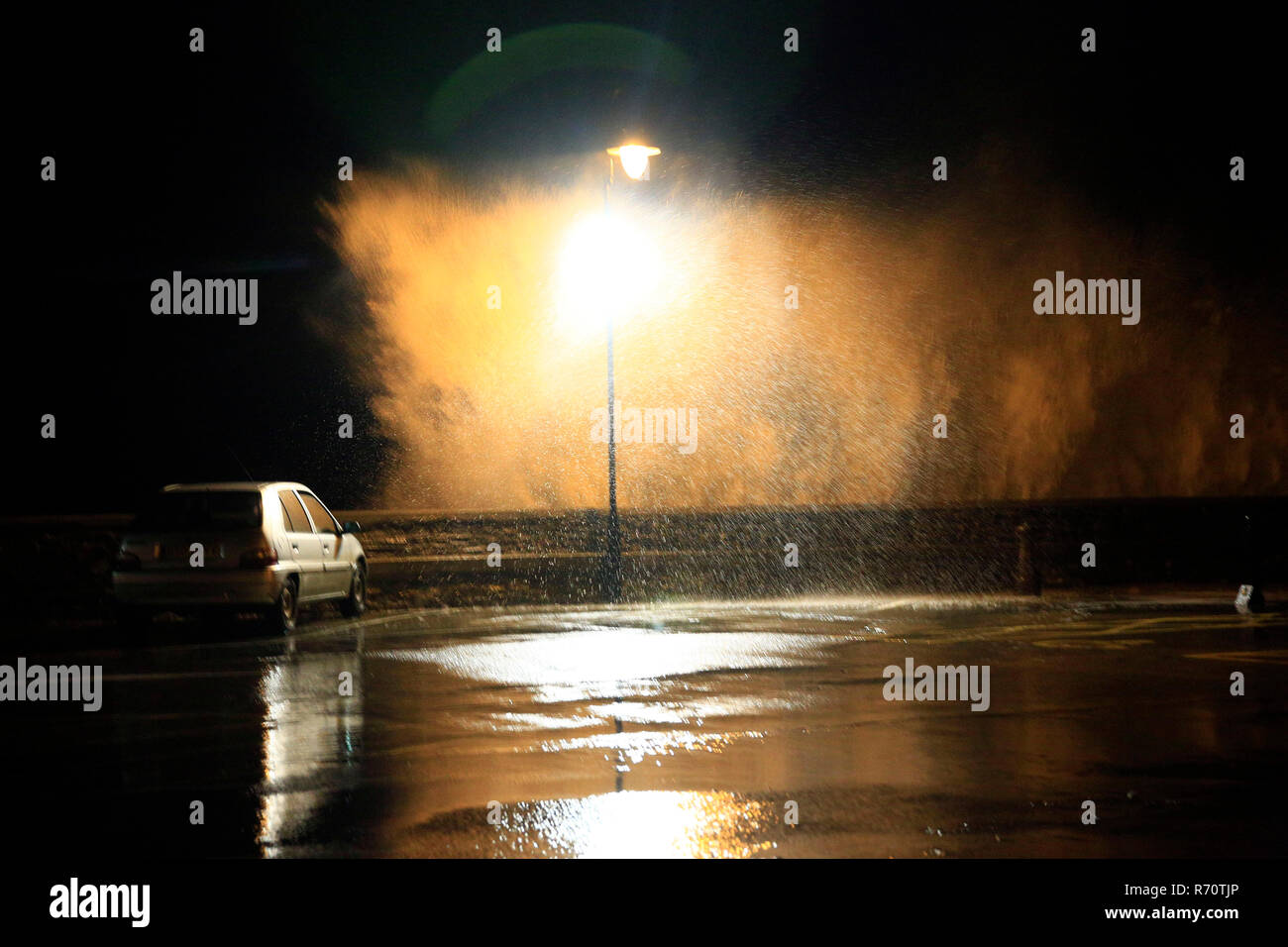 Very strong winds coincided with high tides in the North Devon coastal town of Ilfracombe this evening. Stock Photo