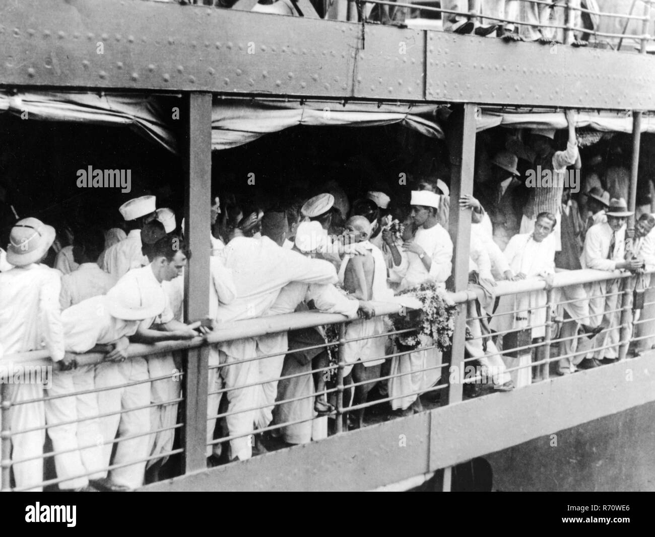 Mahatma Gandhi on deck of S.S. Rajputana British passenger ship with people before his departure to England, Bombay, Mumbai, India, August 29, 1931, old vintage 1900s picture Stock Photo