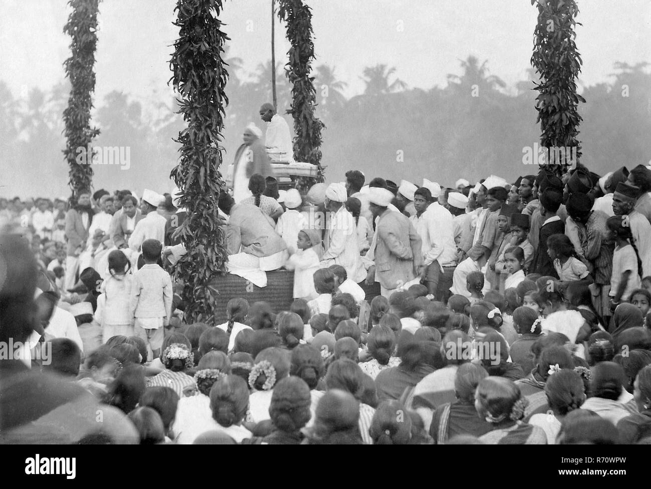 Mahatma Gandhi sitting on stage at a public meeting in South India, February 28, 1934, old vintage 1900s picture Stock Photo
