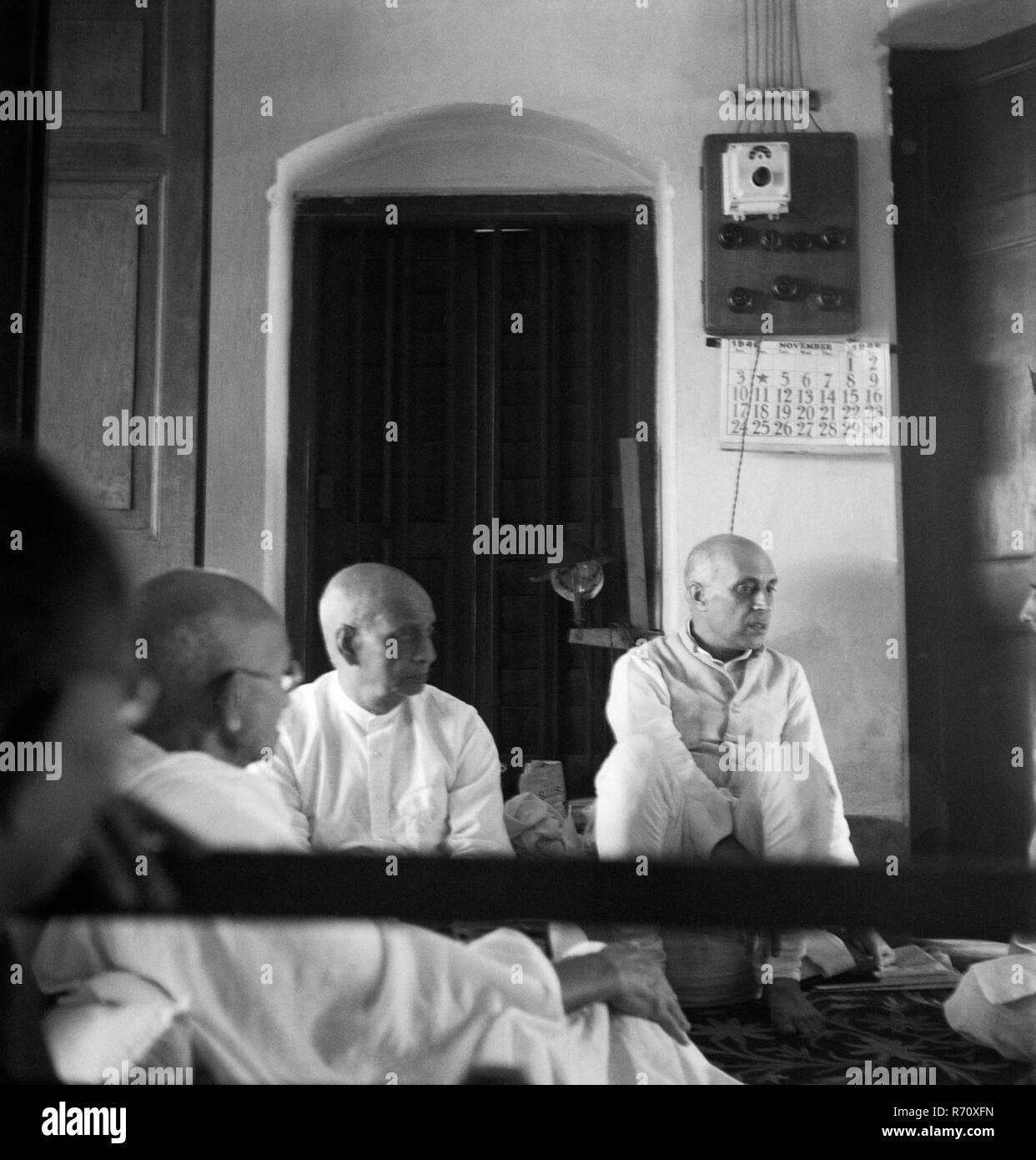 Mahatma Gandhi, Sardar Vallabhbhai Patel and Jawaharlal Nehru listen to report about riots at Calcutta, West Bengal, India, 1946, old vintage 1900s picture Stock Photo