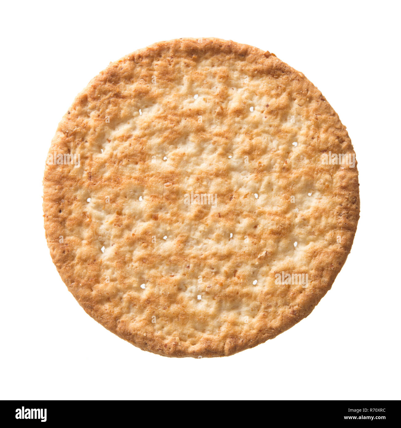 Top view wheat cracker. A single piece whole meal oat biscuit isolated on white background Stock