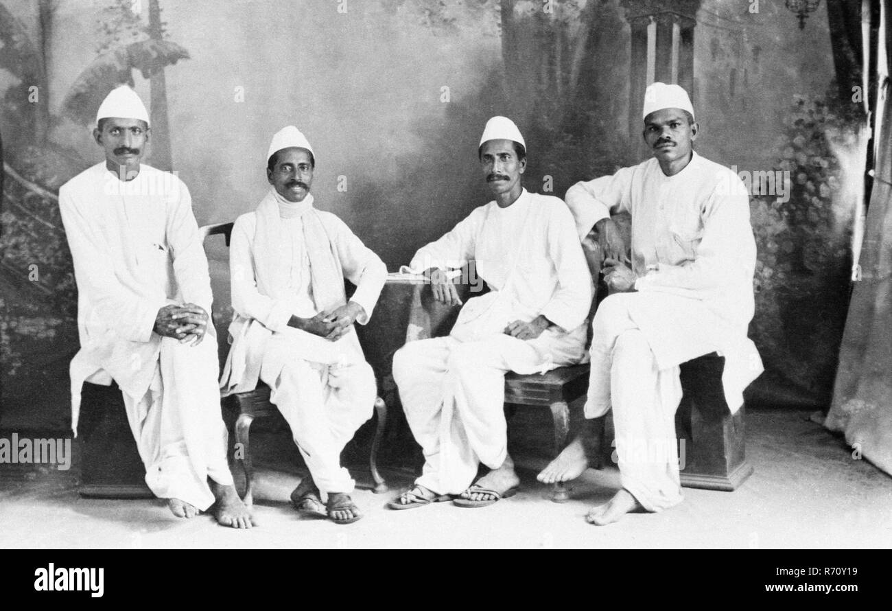 Studio photograph of four men wearing Nehru Cap, India, Asia, old vintage  1900s picture Stock Photo - Alamy