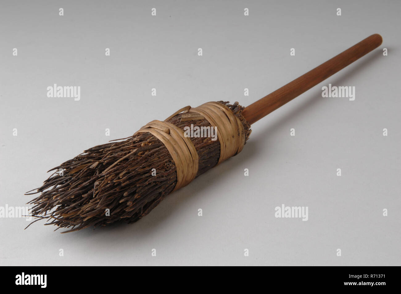 Te Poel, Wooden miniature witches broom, broom miniature kitchen utensils toy relaxant model wood rattan h 37.0, twisted bound Street broom of tied twigs on stick 1868 Sibilla van Embden playing cleaning kitchen Stock Photo