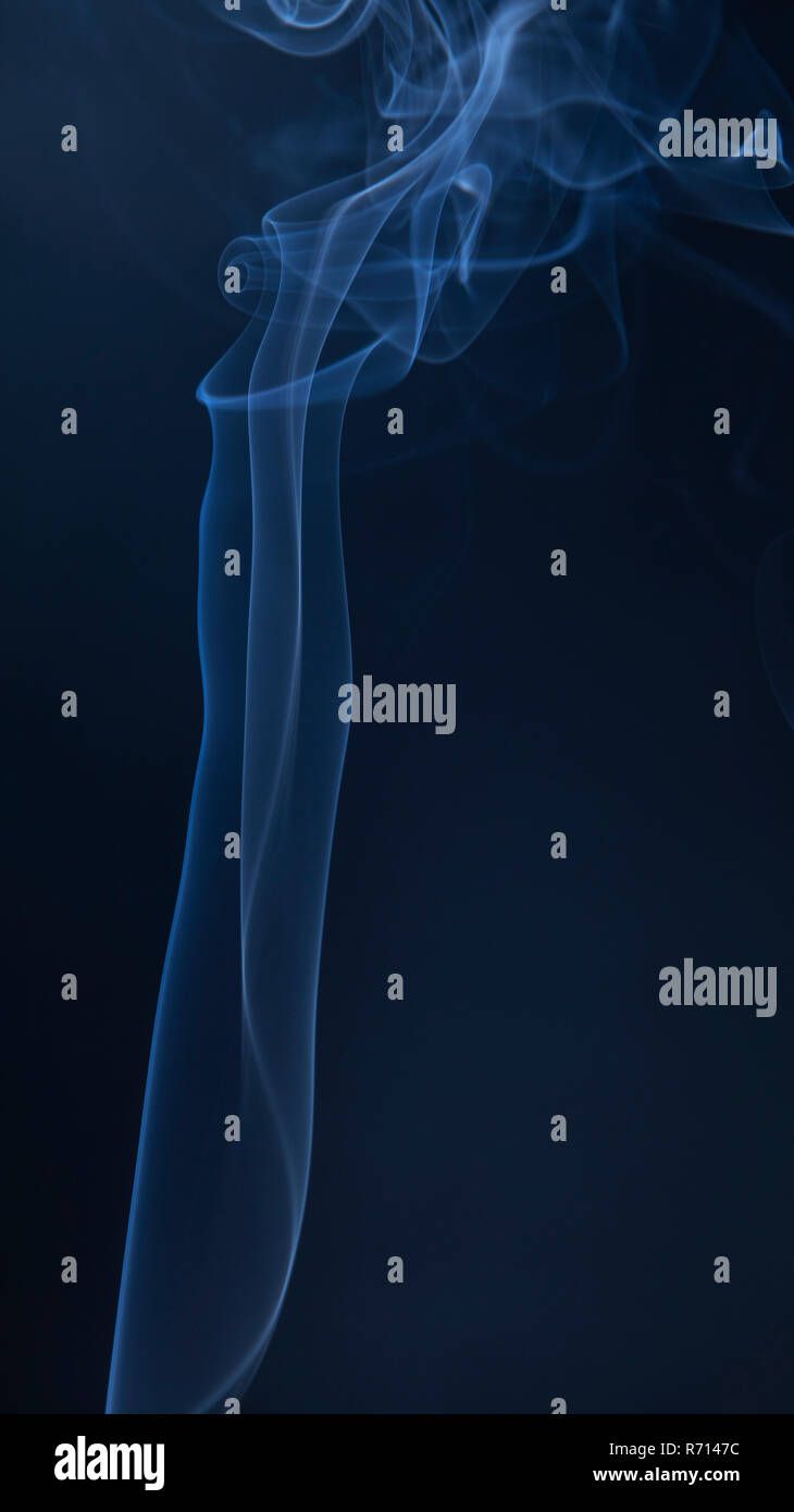 Abstract blue smoke swirls on dark background Stock Photo - Alamy