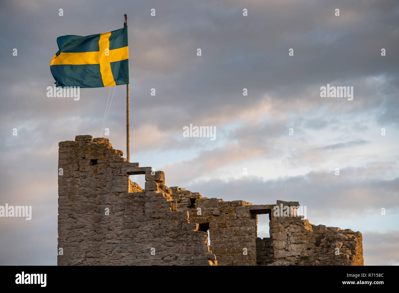 Swedish flag on medieval city wall, Unesco World Heritage Site, Visby, Gotland Island, Sweden Stock Photo