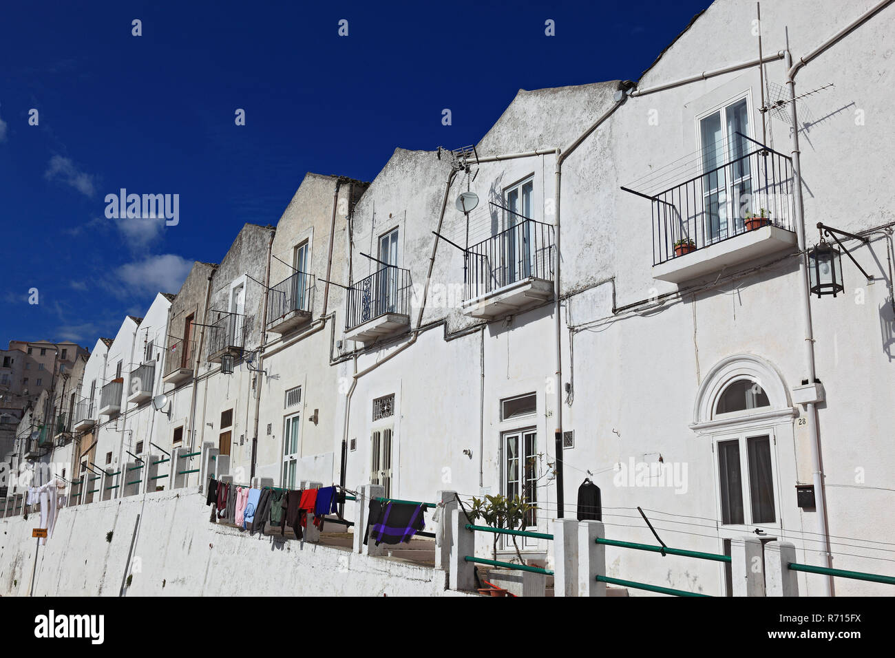 White houses along the road, Monte Sant Angelo, Gargano, Apulia, Italy Stock Photo