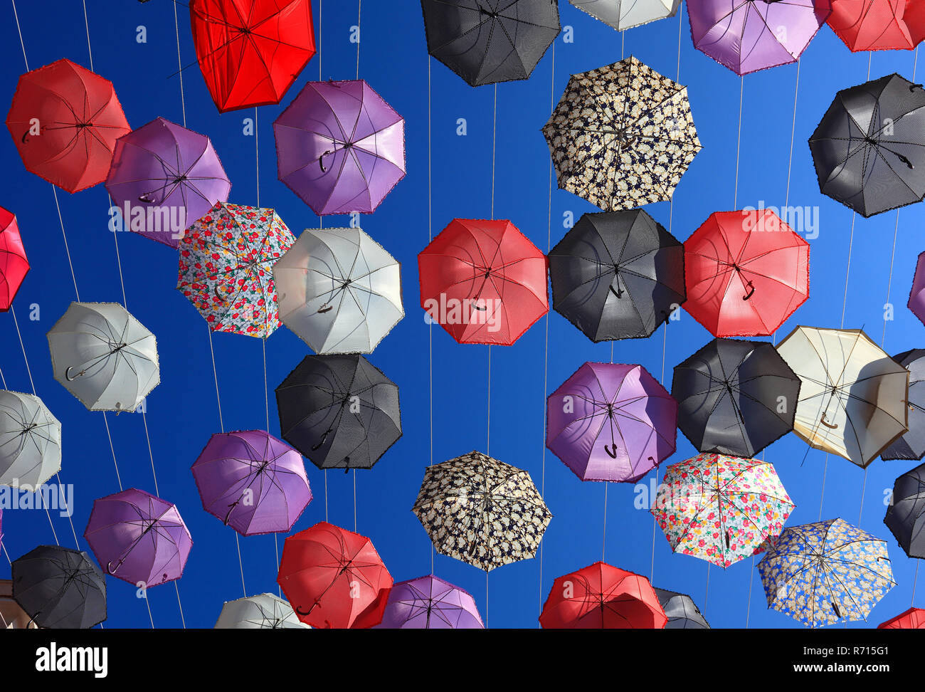 Open umbrellas, parasols as street decoration, Manfredonia, Appulien, Italy Stock Photo