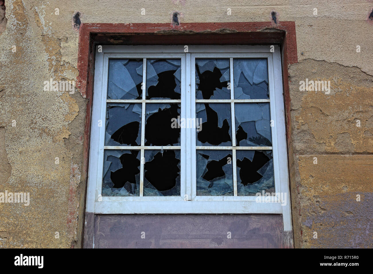 Broken window with glazing bars, single panes broken, old building, Saxony, Germany Stock Photo