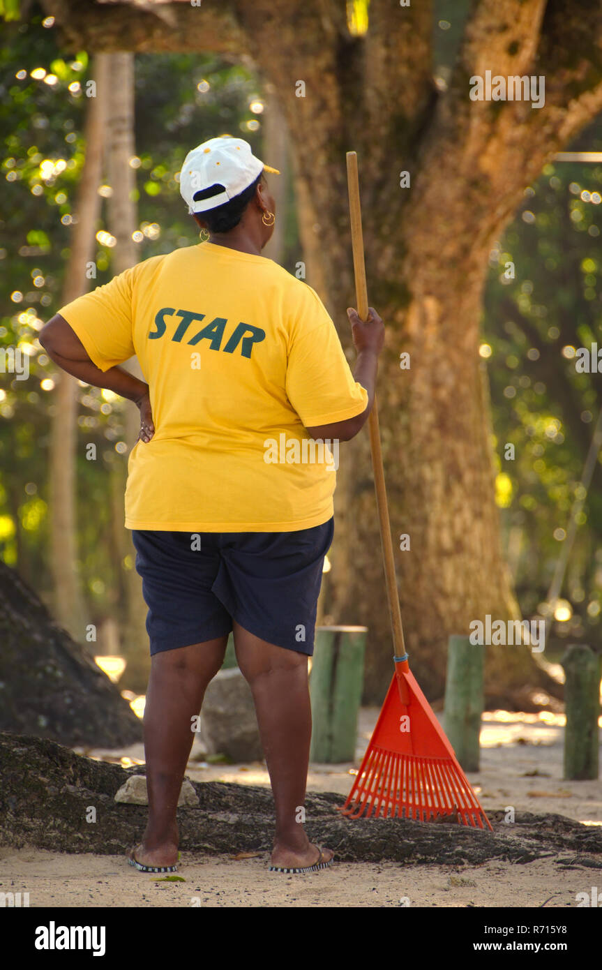 Major woman worker in a shirt with the inscription "star", Mahe Island, Seychelles Stock Photo