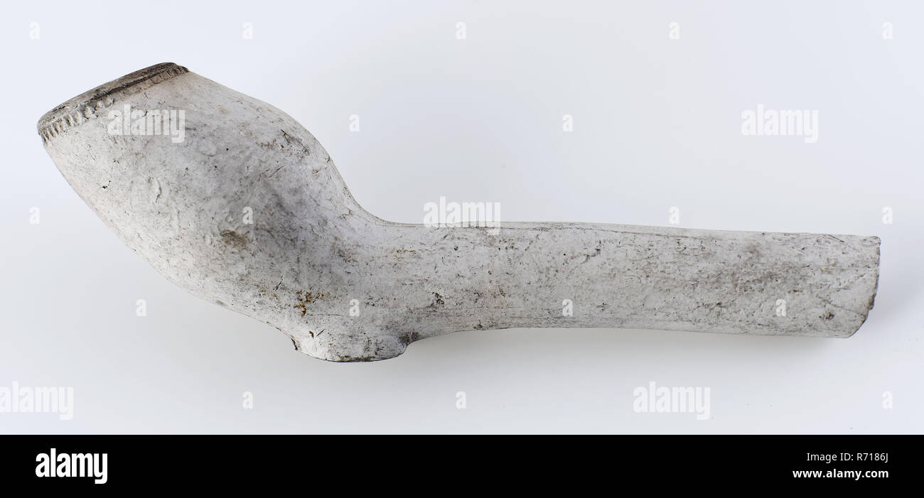 White clay pipe, unnoticed, stem decorated with fleur de lis stamps, clay pipe smoking equipment smoke floor pottery ceramics pottery, hand shaped baked white clay pipe unnoticed handle decorated with fleur de lis stamps archeology smoking tobacco Stock Photo