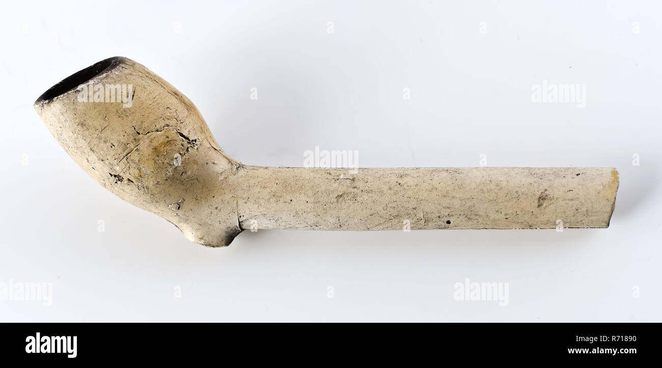 White clay pipe, unnoticed, with smooth handle, clay pipe smoking equipment smoke floor pottery ceramics pottery, pressed finished baked White clay pipe unnoticed with smooth handle. Boiler shows shrinkage or pressure cracks in pottery archeology smoking tobacco Stock Photo