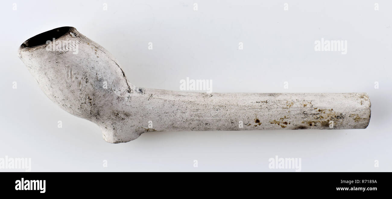 White clay pipe, unnoticed, with smooth handle, clay pipe smoking equipment smoke floor pottery ceramics pottery, pressed finished baked White clay pipe unnoticed with smooth handle. Pressing seam still present on the boiler archeology smoking tobacco Stock Photo