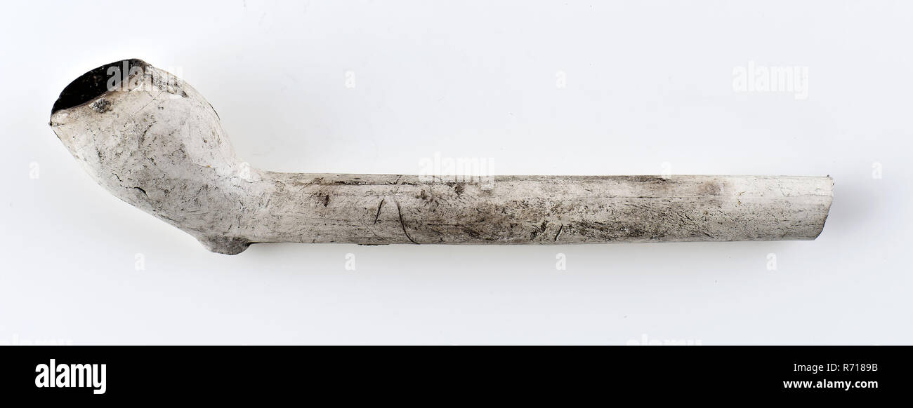 White clay pipe, unnoticed, with smooth handle, clay pipe smoking equipment smoke floor pottery ceramics pottery, pressed finished baked White clay pipe unnoticed with smooth handle. Press seam still present on the stem at the bottom archeology smoking tobacco Stock Photo