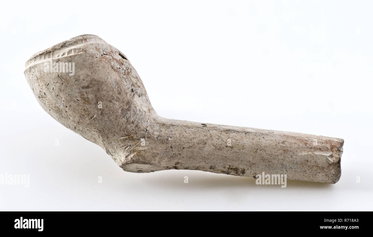 White clay pipe, unnoticed, with smooth handle, clay pipe smoking equipment smoke bottom pottery ceramic pottery, pressed finished baked white clay pipe unnoticed with smooth handle Very small and probably very early clay pipe archeology smoking tobacco Stock Photo