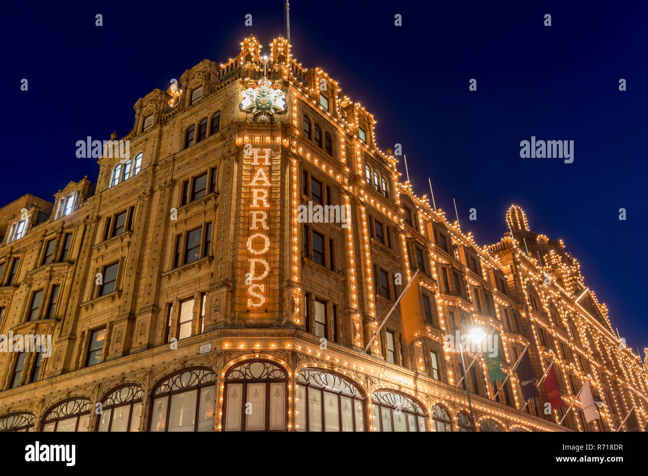 Illuminated department store Harrods, night scene, London, Great Britain Stock Photo