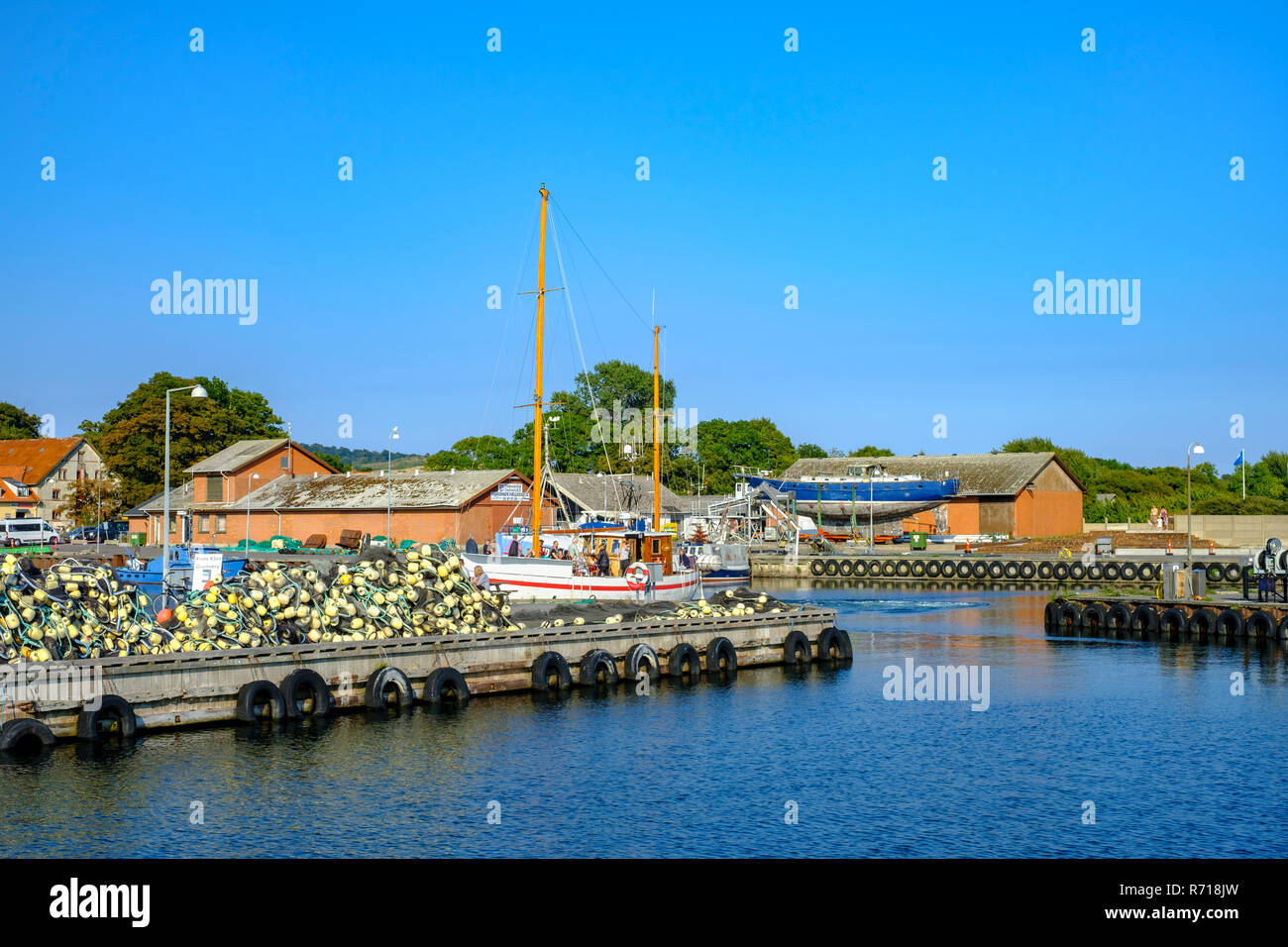 Klintholm Havn, Denmark - August 16, 2018: The DISCOVERY sailing cutter approaches the port of Klinholm Havn after an excursion with tourists. Stock Photo