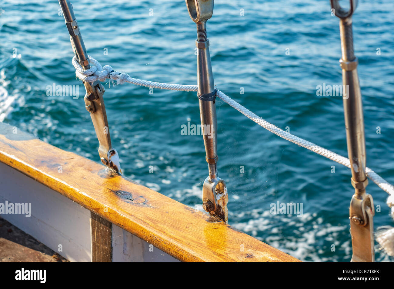 The details of the rigging of a sailing cutter create a maritime atmosphere. Stock Photo