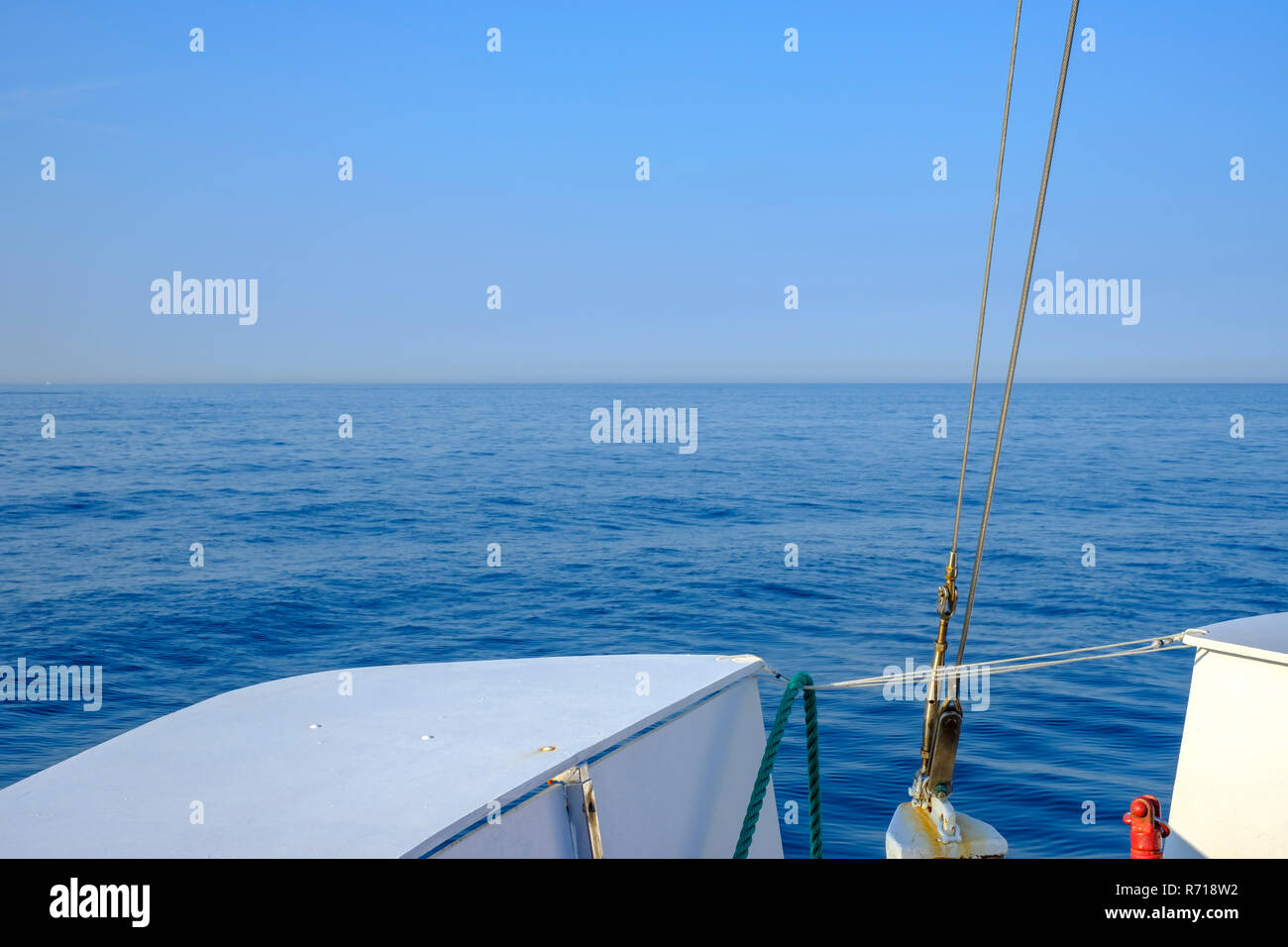Maritime view from the bow of a ship to the open sea out to the horizon. Stock Photo