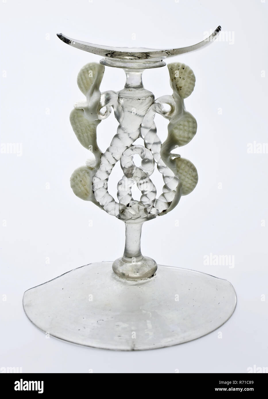 https://c8.alamy.com/comp/R71C89/fragment-of-foot-trunk-and-calyx-of-wing-glass-wine-glass-drinking-glass-drinking-utensils-tableware-holder-soil-find-glass-free-blown-and-formed-appliqu-fragment-of-foot-trunk-and-very-small-part-of-calyx-of-wing-glass-in-clear-colorless-and-white-opaque-glass-pontil-mark-under-concave-ascending-foot-flat-knot-and-solid-short-trunk-to-flat-knot-twisted-glass-wire-in-pretzel-on-both-sides-ascending-continuously-to-short-solid-trunk-to-flat-knot-and-attachment-of-calyx-waffled-glass-thread-in-white-opaque-glass-attached-on-both-sides-in-waffle-pattern-small-part-of-drinking-bowl-shaped-R71C89.jpg