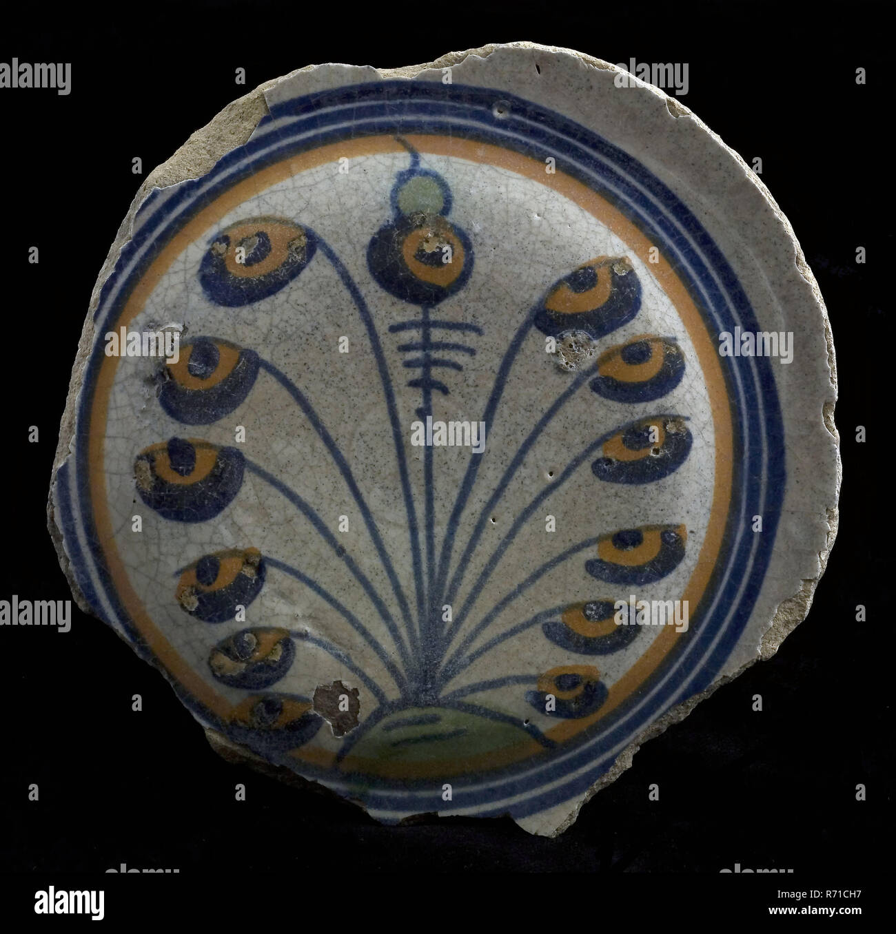Fragment majolica dish, polychrome, flower with buds on fan-shaped stalks, plate crockery holder soil find ceramic earthenware enamel, baked underside covered with lead glaze. Polychrome waised soul of pancake dish or salad dish archeology decorate food serve tulip variety Stock Photo