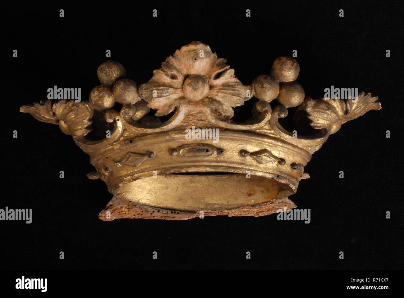 Carved wooden gilded crown, broken off from coat of arms, fragment woodcarving sculpture footage wood gold, heraldry regent Rotterdam City Center Stadsdriehoek Hoogstraat Gasthuis Rotterdam. Stock Photo