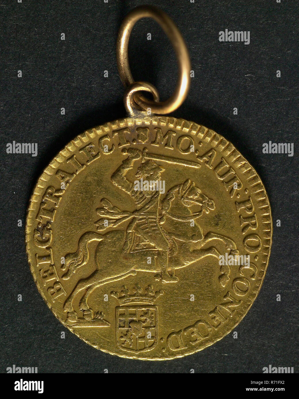 Half gold rider 1760 from Utrecht, half gold barrier currency money swap pendant ornament clothing accessory clothing gold, Coin to pendant entertained, MO: AUR: PRO: CONFOED: -BELG: TRAIECT: (Gold money from the United Netherlands Utrecht) mint sign Utrecht pay Stock Photo