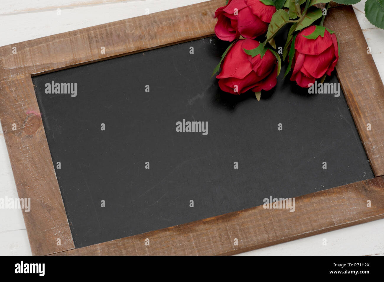 concept romantic, small chalkboard with roses Stock Photo - Alamy