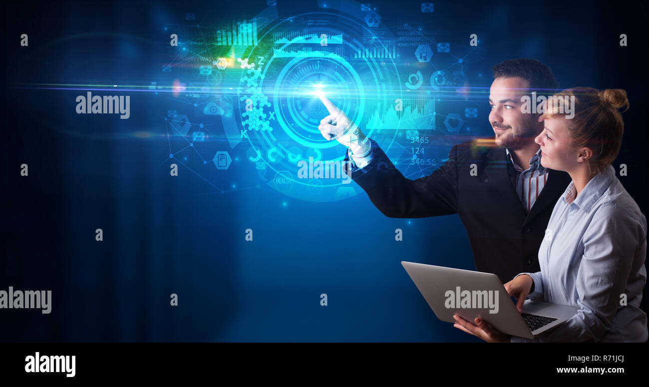 Man and woman touching hologram screen displaying medical symbols and charts Stock Photo