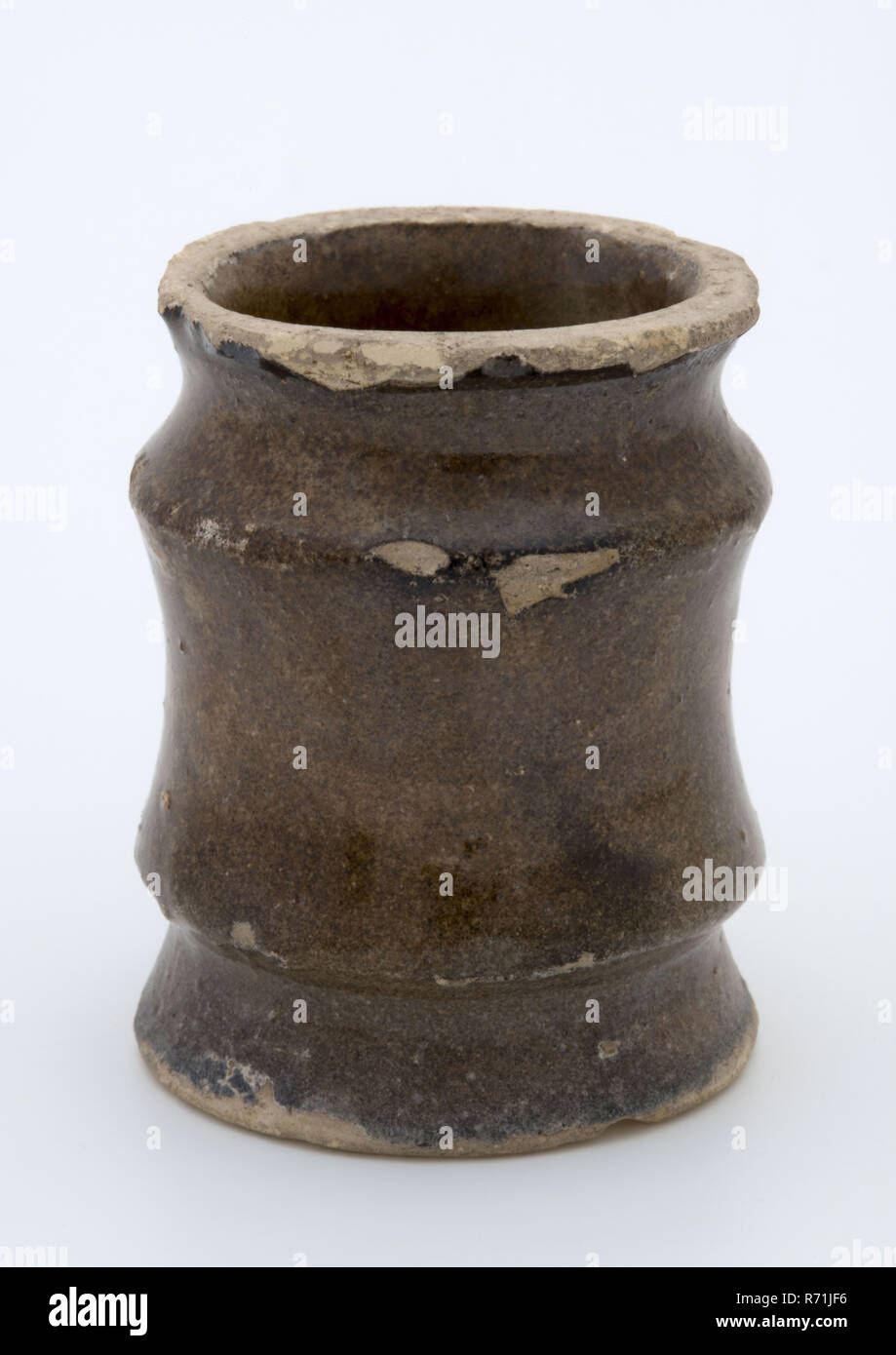 Pottery ointment jar, cylindrical with three constrictions, white glazed, ointment jar pot holder soil find ceramic earthenware glaze tin glaze, hand-turned baked 2x glazed earthenware ointment jar cylindrical in shape with three necking Fully glazed white. Stand area with deducting rails. Dark discolored by staying in the soil. So called Delftware in the form of an albarello archeology health care indigenous pottery packing pharmacy store selling medicine drug craft Stock Photo