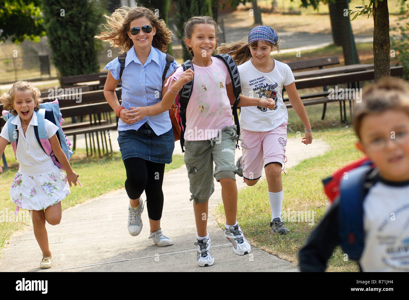 Group of schoolchilds running     Photo © Daiano Cristini/Sintesi/Alamy Stock Photo Stock Photo