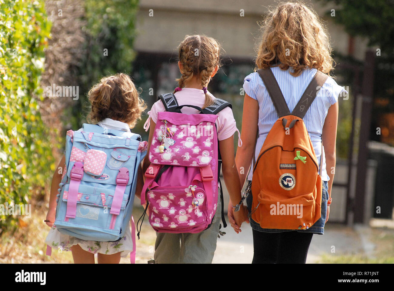 Group of schoolchilds with backpacks    Photo © Daiano Cristini/Sintesi/Alamy Stock Photo Stock Photo