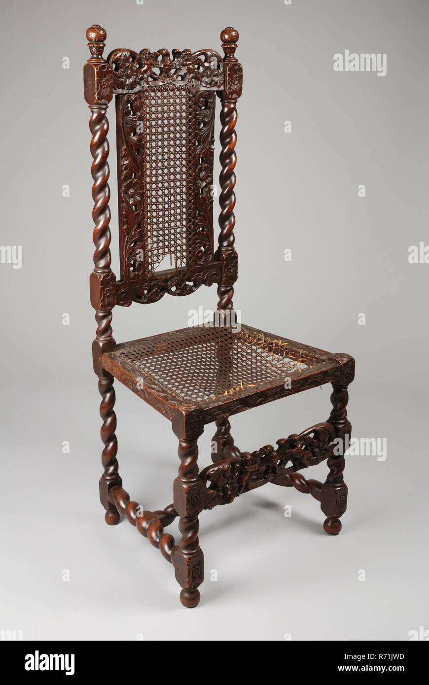 Groenteboer Bot Bridge pier Walnut carved baroque chair, chair furniture interior design wood walnut  rattan, braided seat and back torped legs rules and cover with carving of  putti with eagle baroque Stock Photo - Alamy