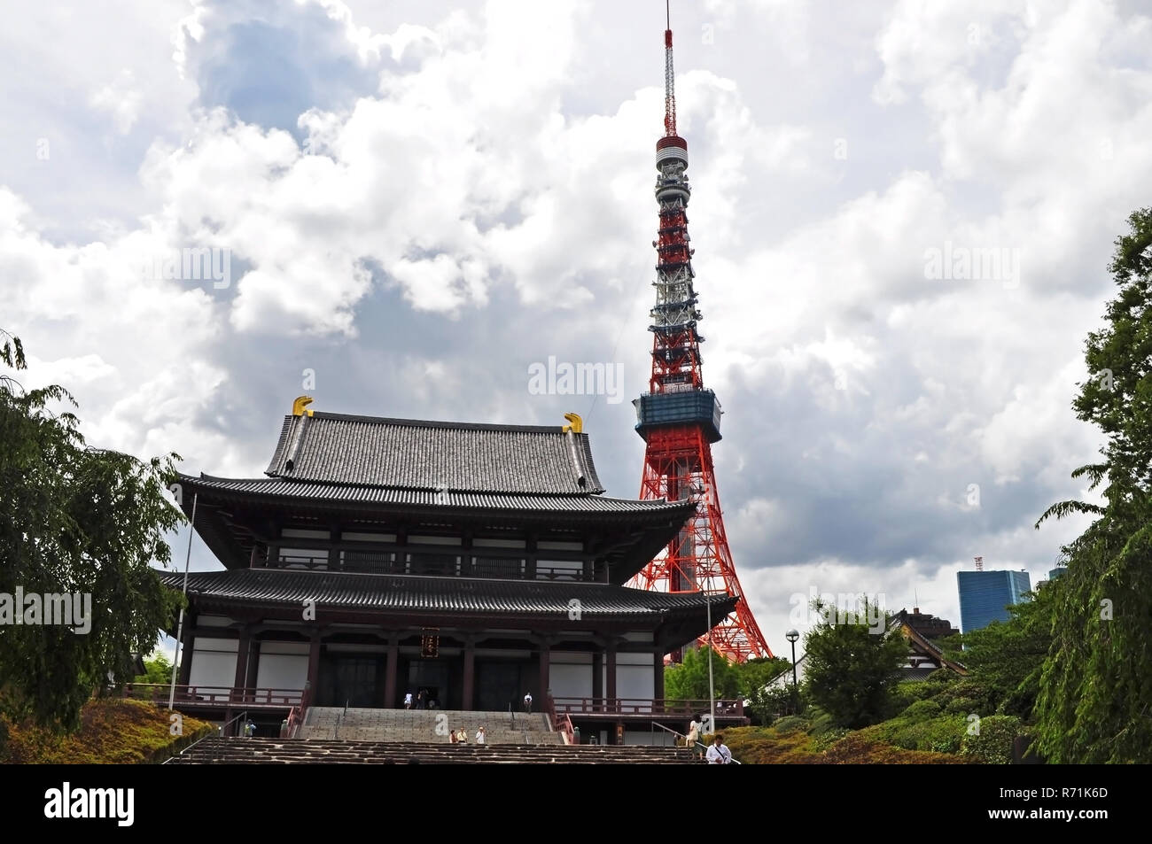 People visiting Zojoji temple with Tokyo tower view in the back Stock Photo