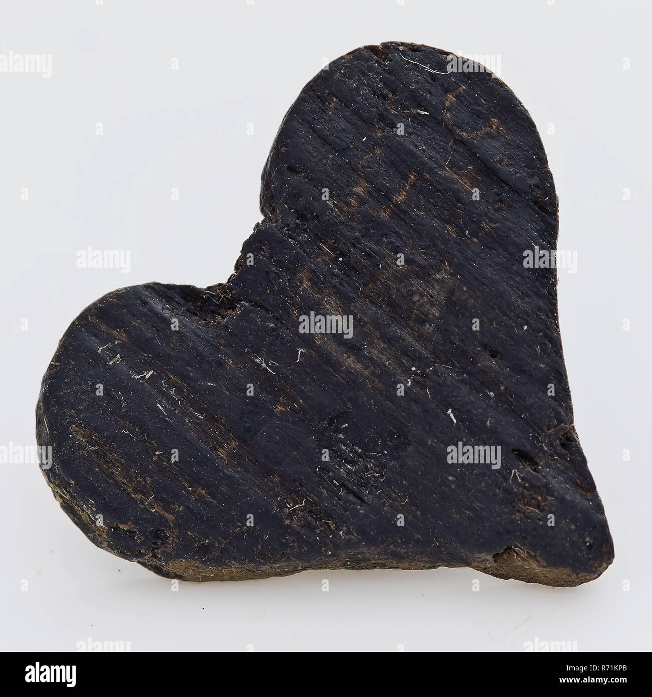 Small wooden heart, decoration soil find wood, sawn cut Wooden heart. Cut out heart of soft wood Clear wood grain archeology Rotterdam IJsselmonde indigenous woodwork decorate Soil discovery: IJsselmonde Castle from the Rotterdam 1972 cesspit. Stock Photo
