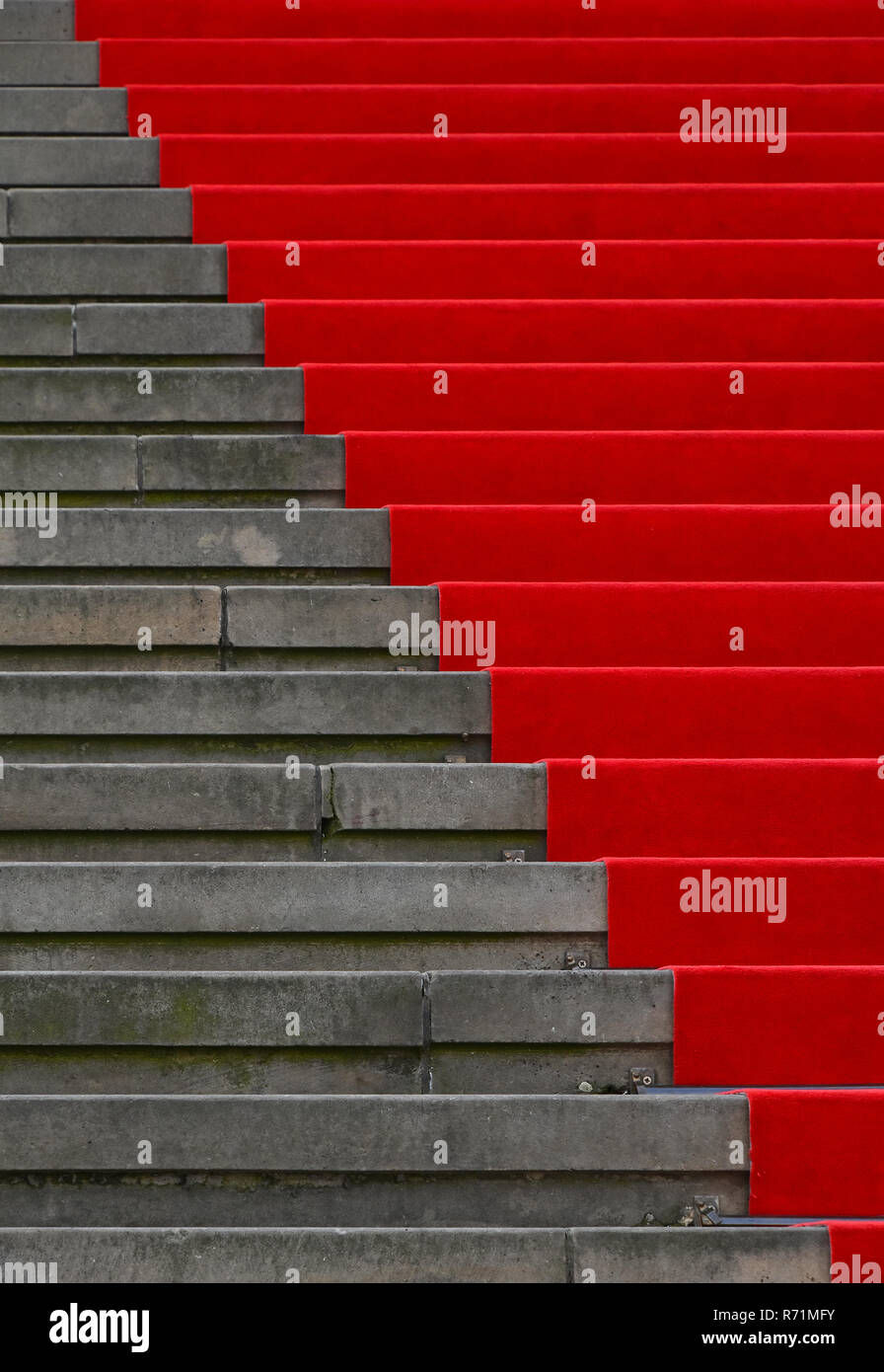 Red carpet over concrete stairs perspective Stock Photo