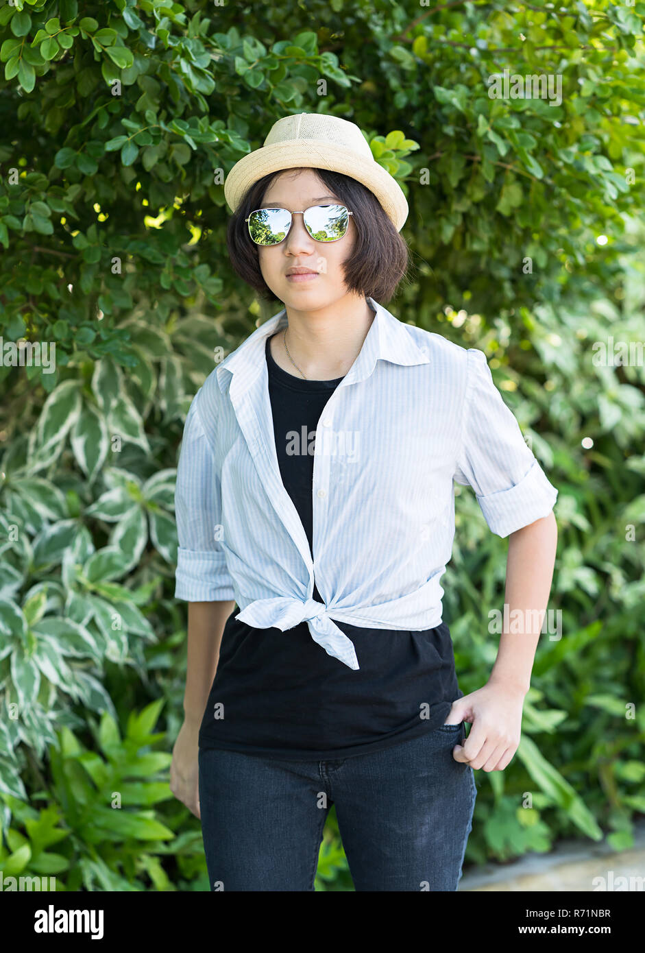 Women With Short Hair Wearing Hat In Park Stock Photo 228076123